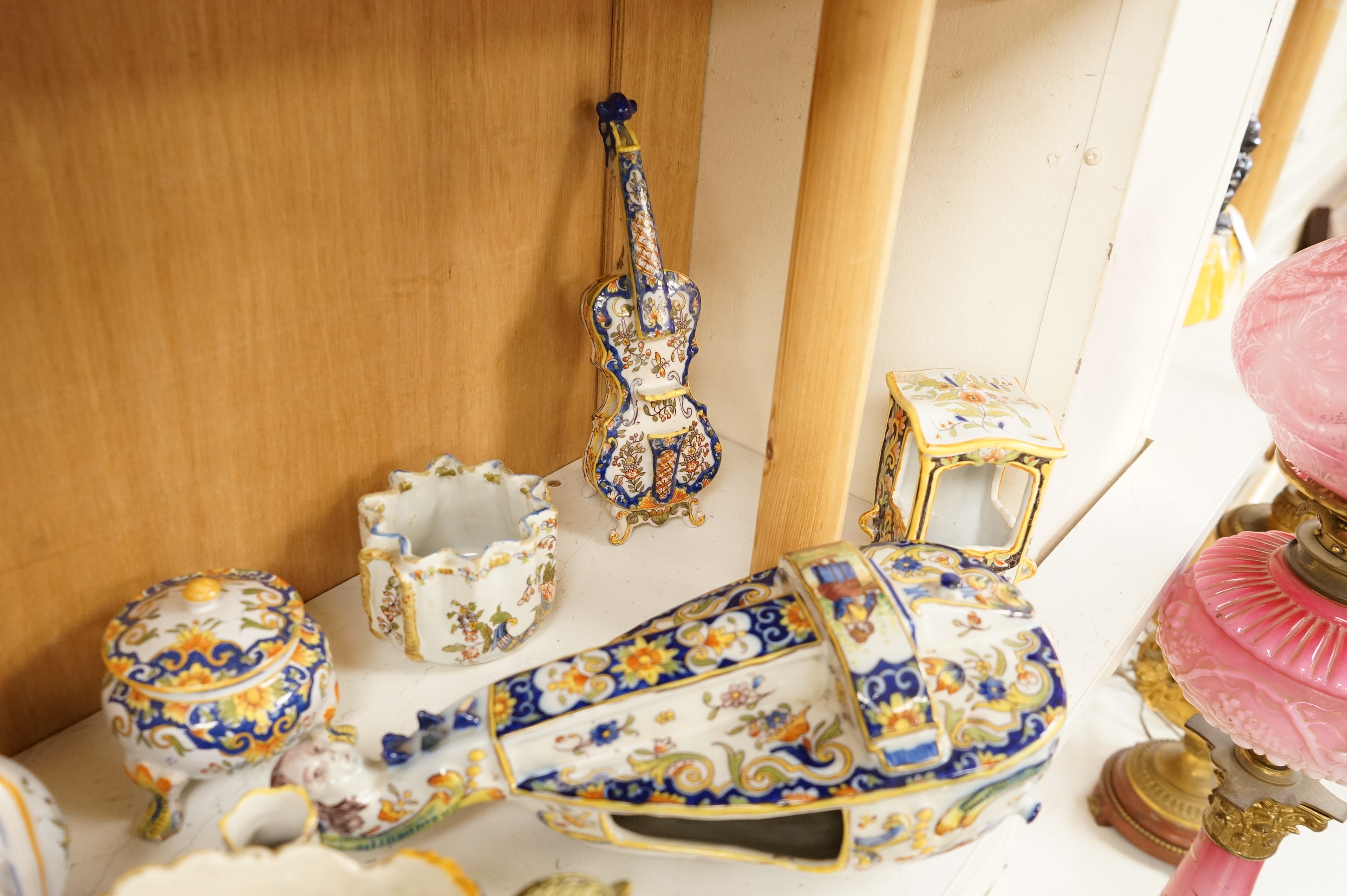 A group of French faience pottery to include trinket boxes, a teapot and vases, largest 32cm in length